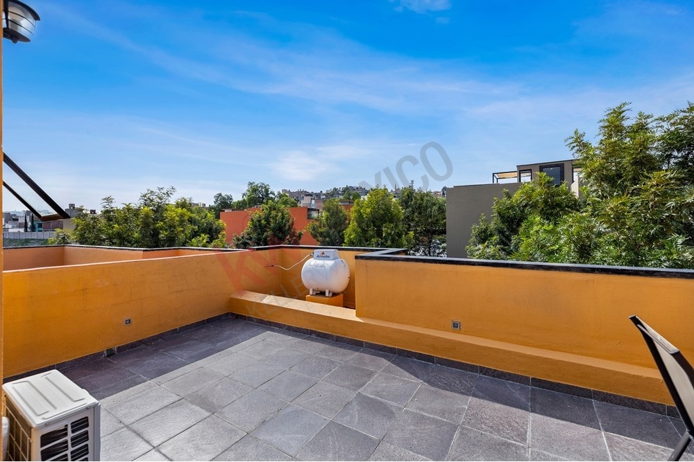 17 of 27: Private Rooftop Terrace with Panoramic City and Tree Views.