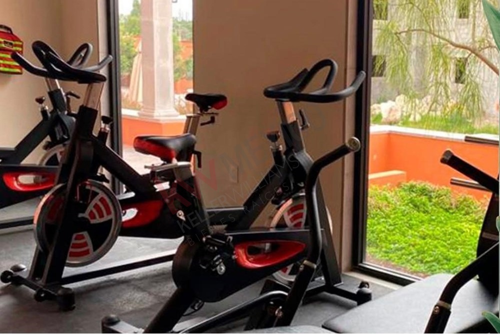 20 of 27: Community Gym, Exercise Bikes, Amenity View Windows.