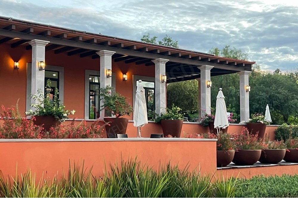 21 of 27: Community Terrace, Covered Seating, Lush Landscaped Gardens.