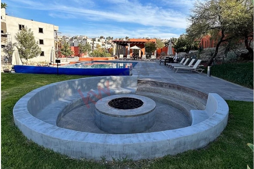 23 of 27: Communal Fire Pit, Curved Seating, Pool and Lounge.