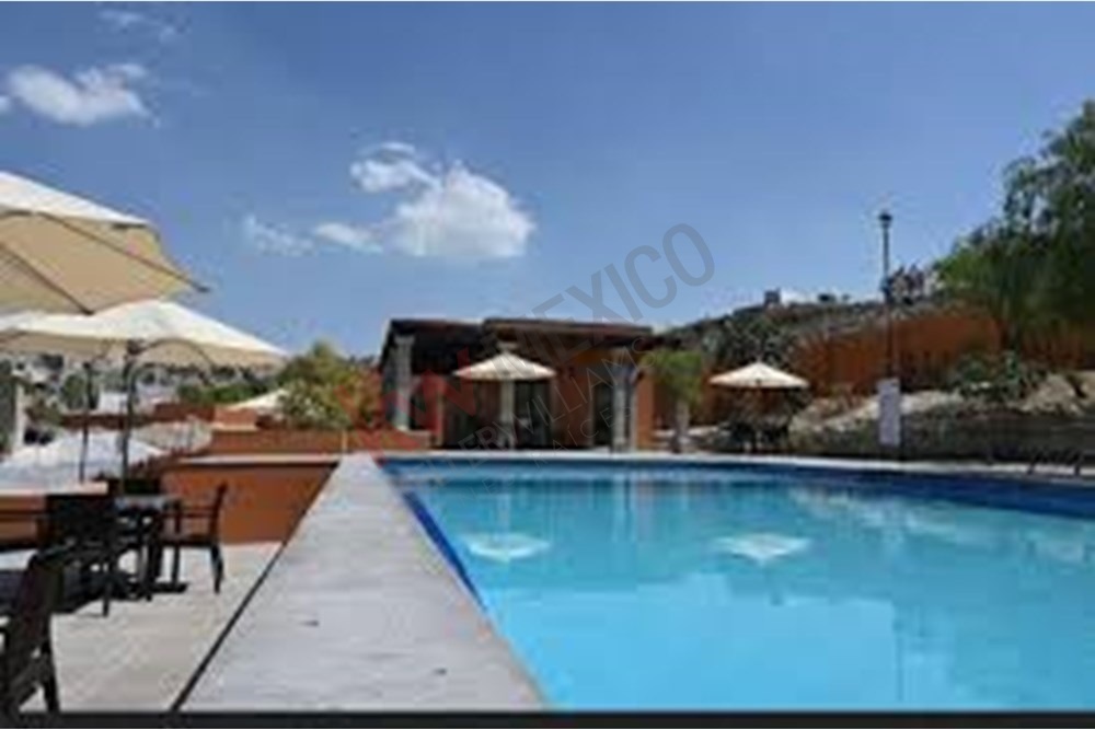 24 of 27: Gated Community Pool, Lounge Area, Umbrellas, Sunny Views.