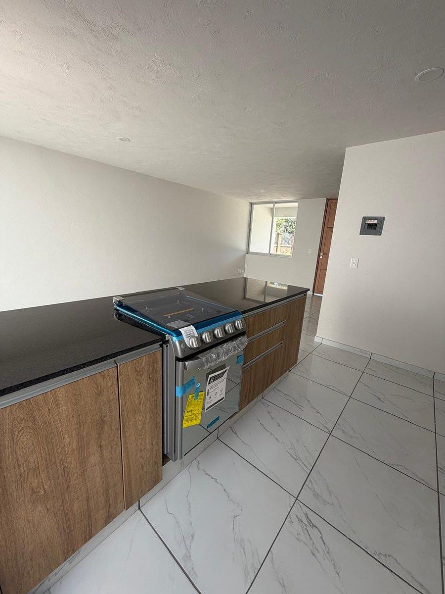 13 de 27: Cocina cubiertq de granito