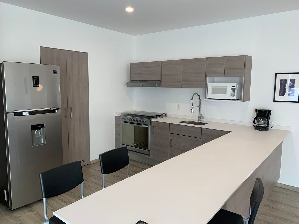 4 de 25: Cocina y Barra Desayunadora