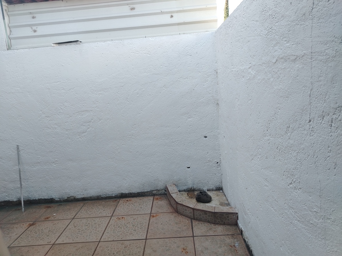 4 de 13: Patio trasero con espacio para fuente