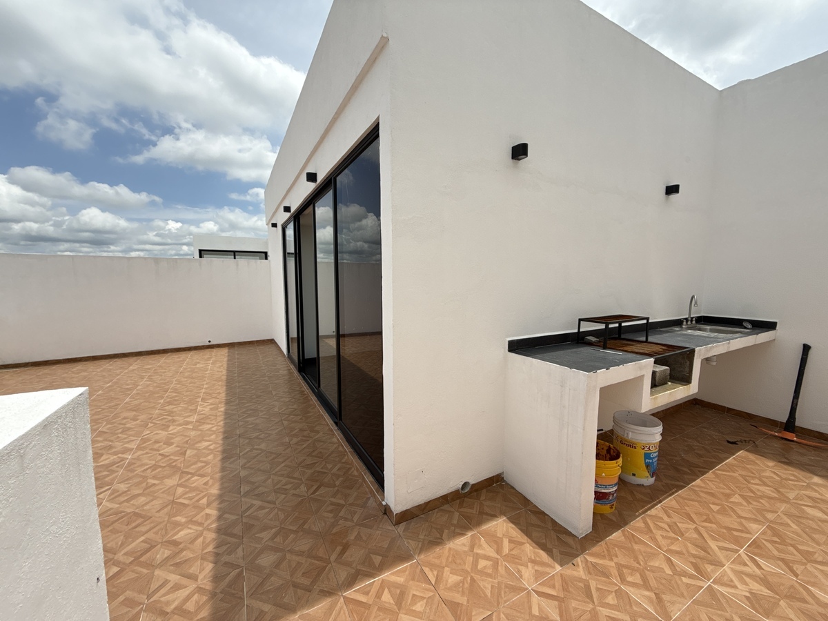 21 of 26: Roof garden con asador y tarja.