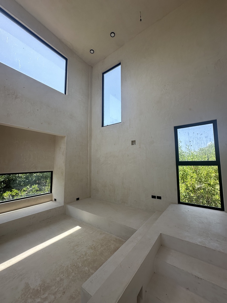 27 of 35: Double height living room with manglar views