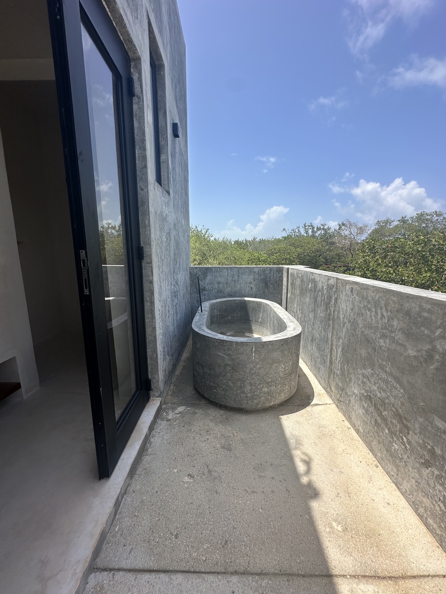 29 of 35: Bathtub overlooking the lush Tulum jungle