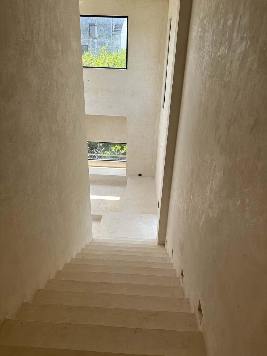 35 of 35: Grand staircase to double height living room