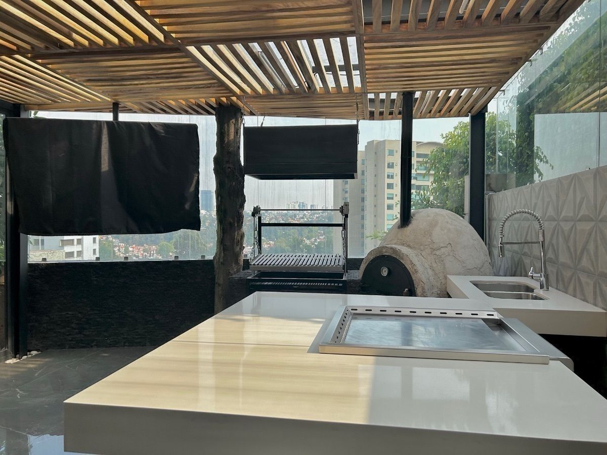 18 de 33: Terraza con área de asador