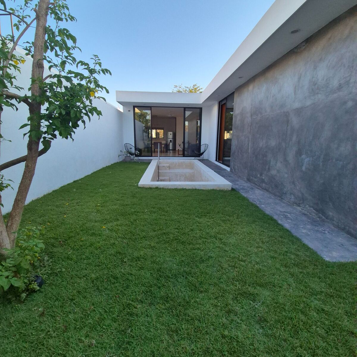 11 of 11: Jardín posterior con piscina