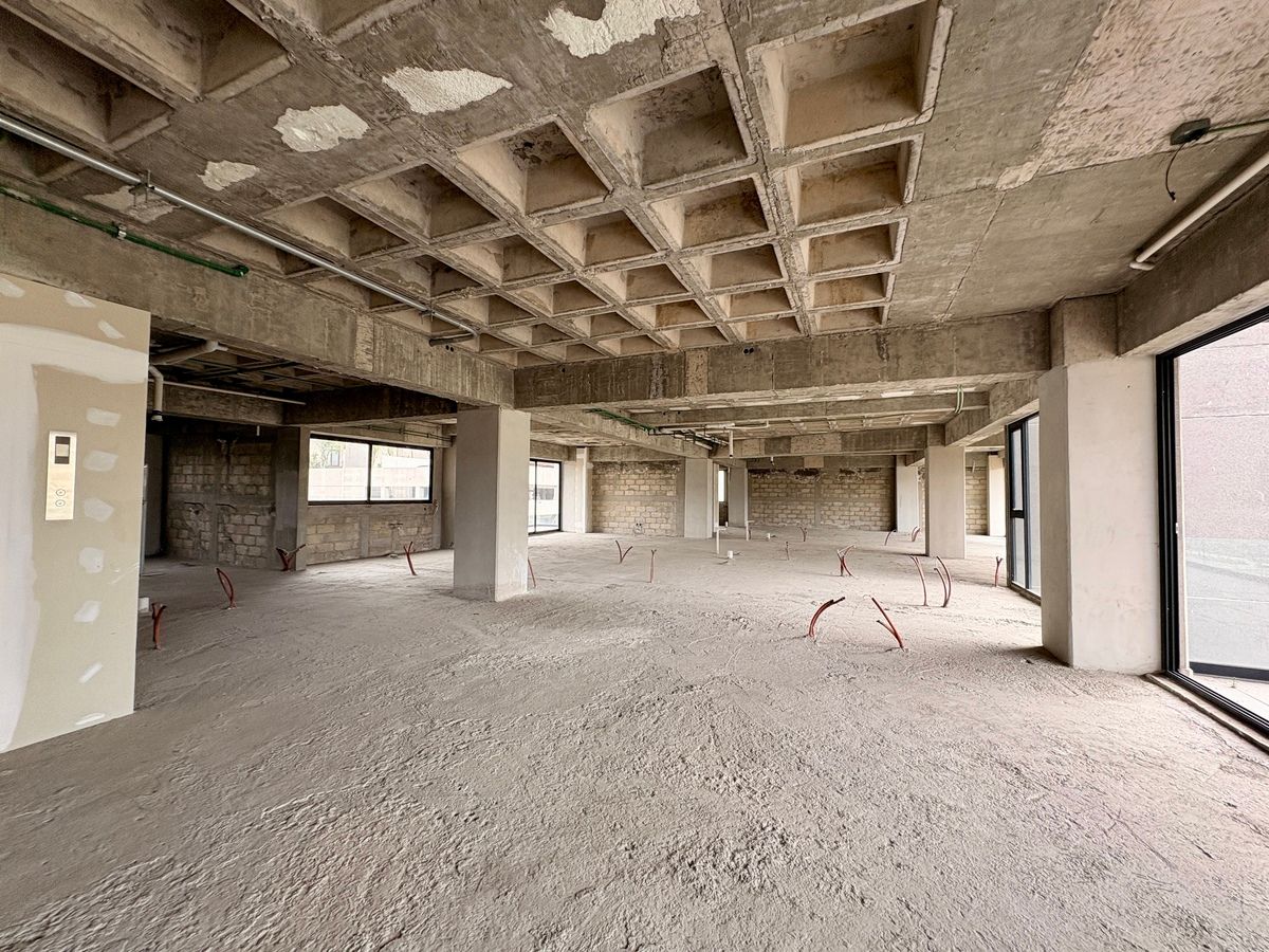 10 de 23: fachada en obra gris. departamento disponible en venta