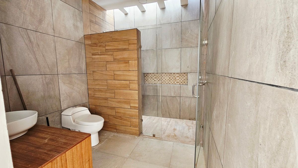 28 de 35: Baño compartido