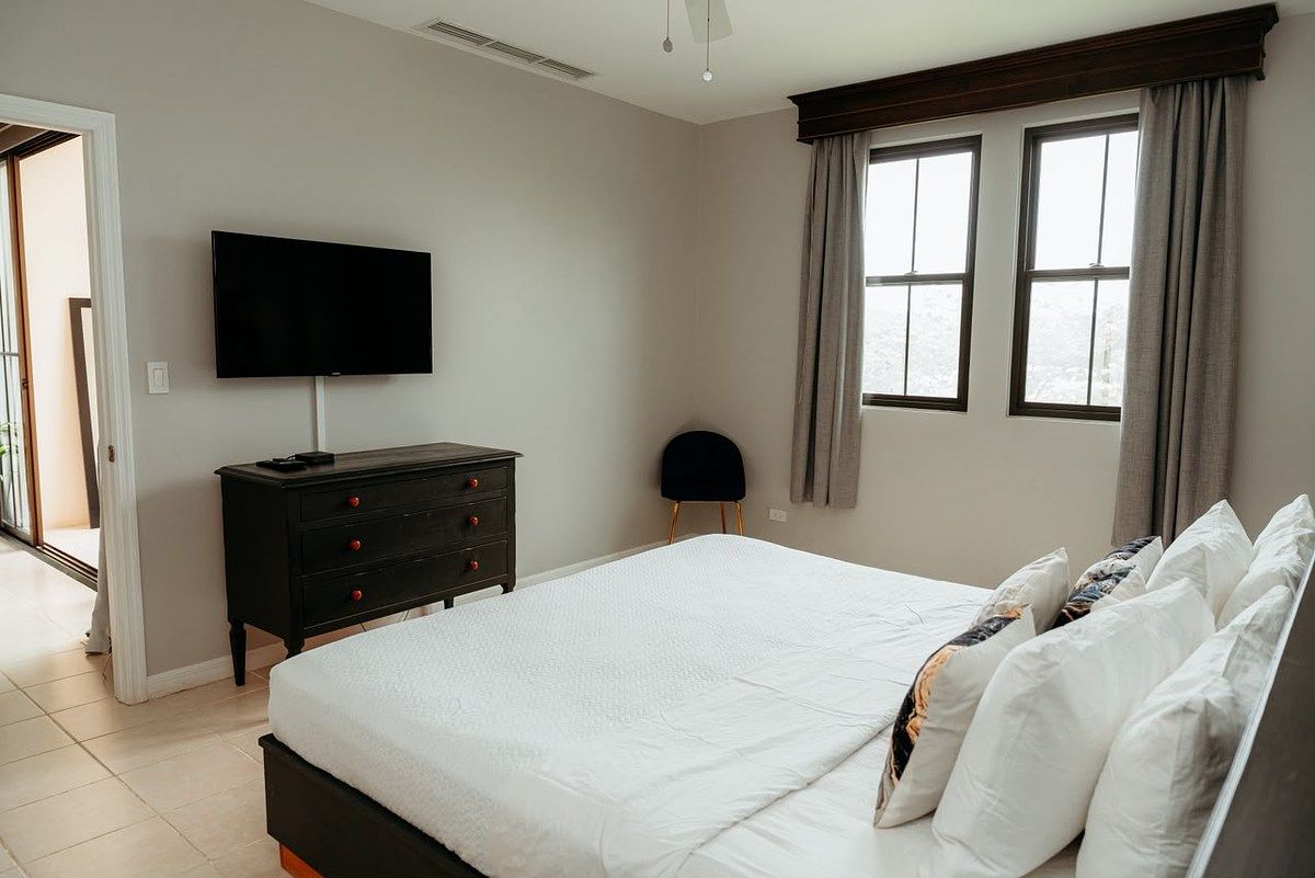 Spacious and Welcoming Main Bedroom with bed and TV., photo 10 of 26