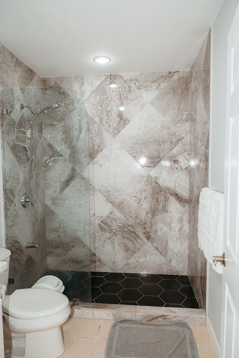 Private shower with a clean, elegant design., photo 20 of 26