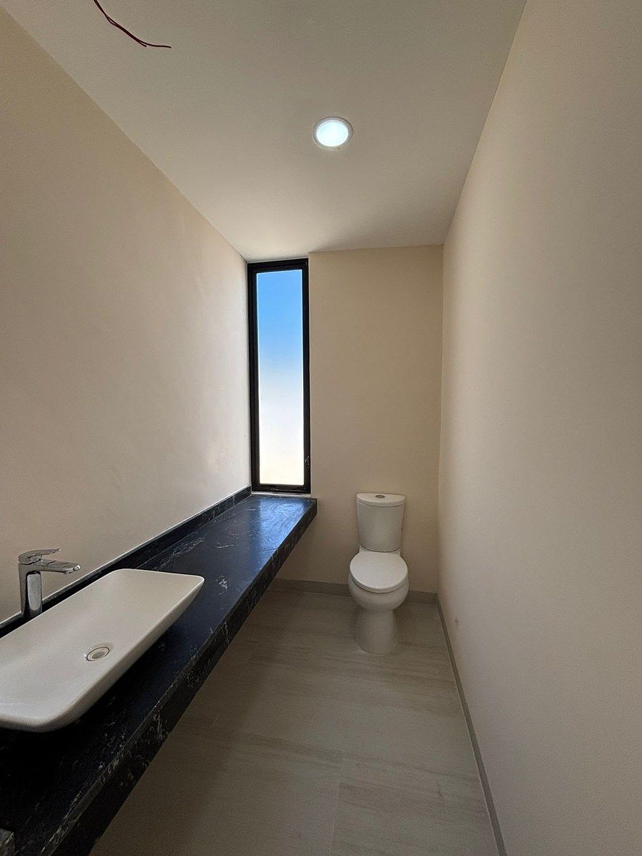 7 de 11: Medio Baño