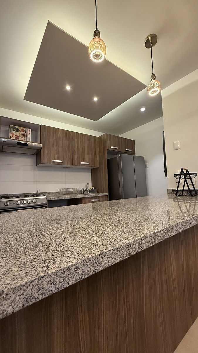 14 de 15: Cocina integral con un amplio Mesón - desayunador