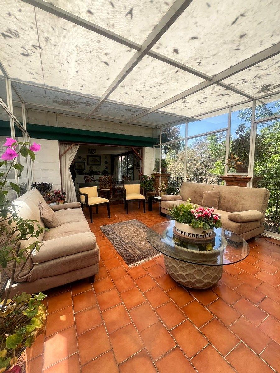 23 of 28: solarium con sala informal