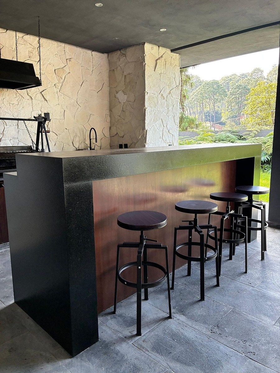 8 de 11: Bar exterior con asador argentino