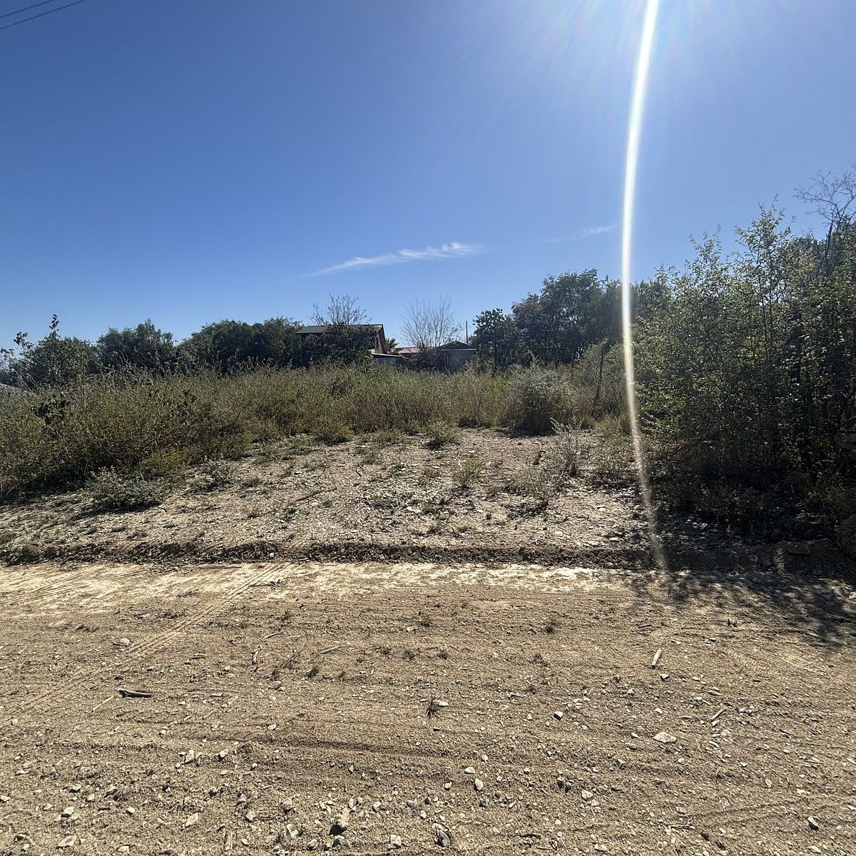 24 of 32: FRENTE TERRENO