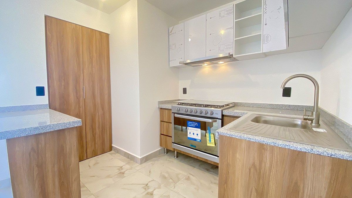 6 de 19: Tatja, estufa, campana y área de lavado