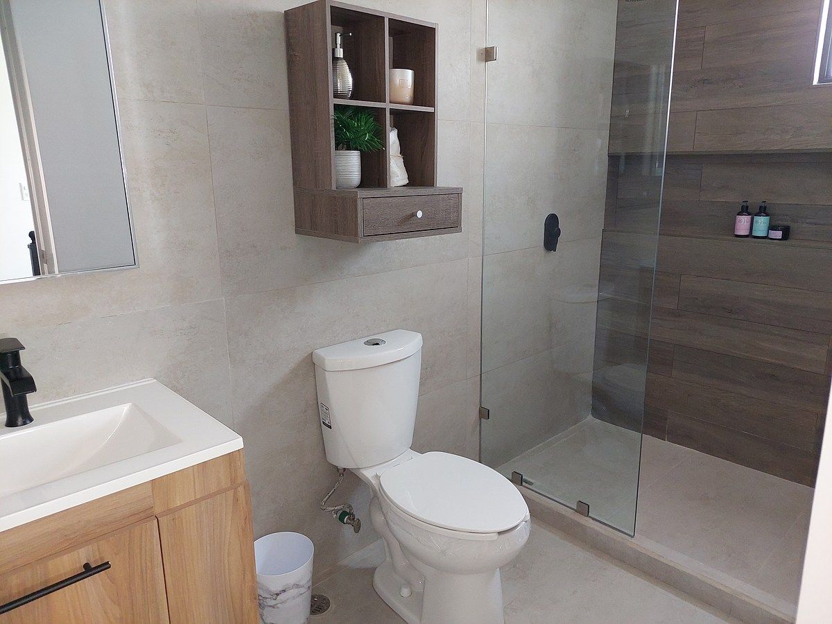 11 de 19: Baño compartido