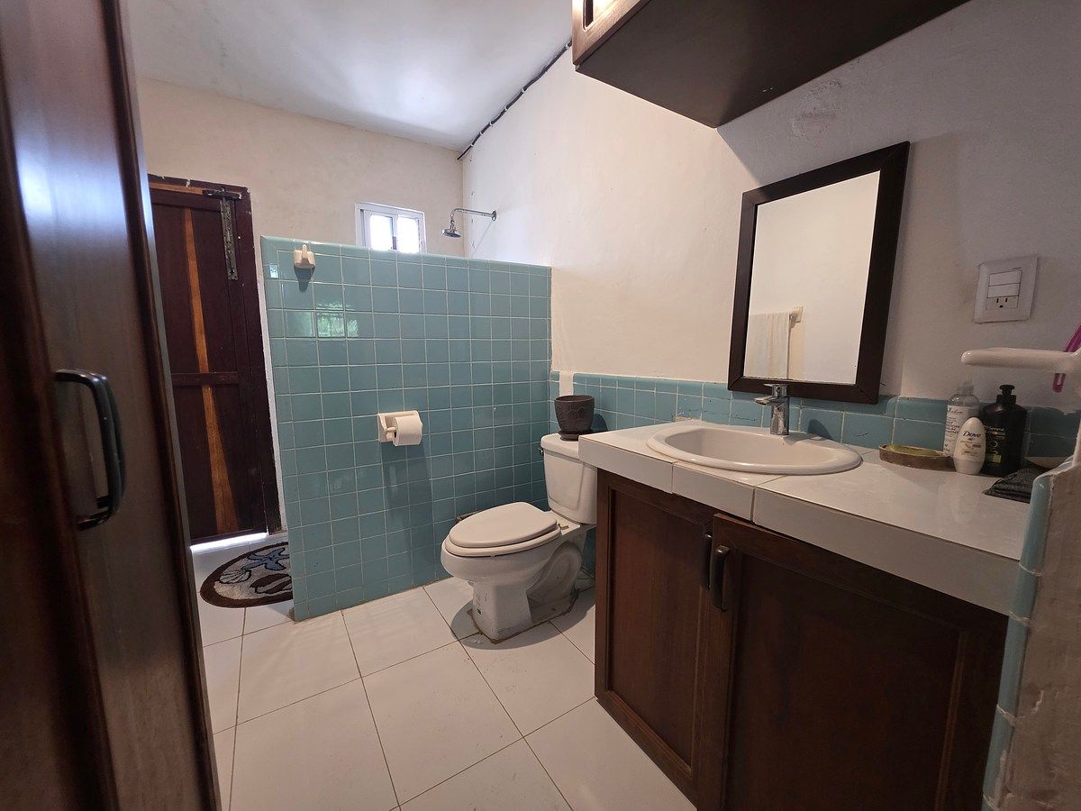 12 de 14: Baño compartido