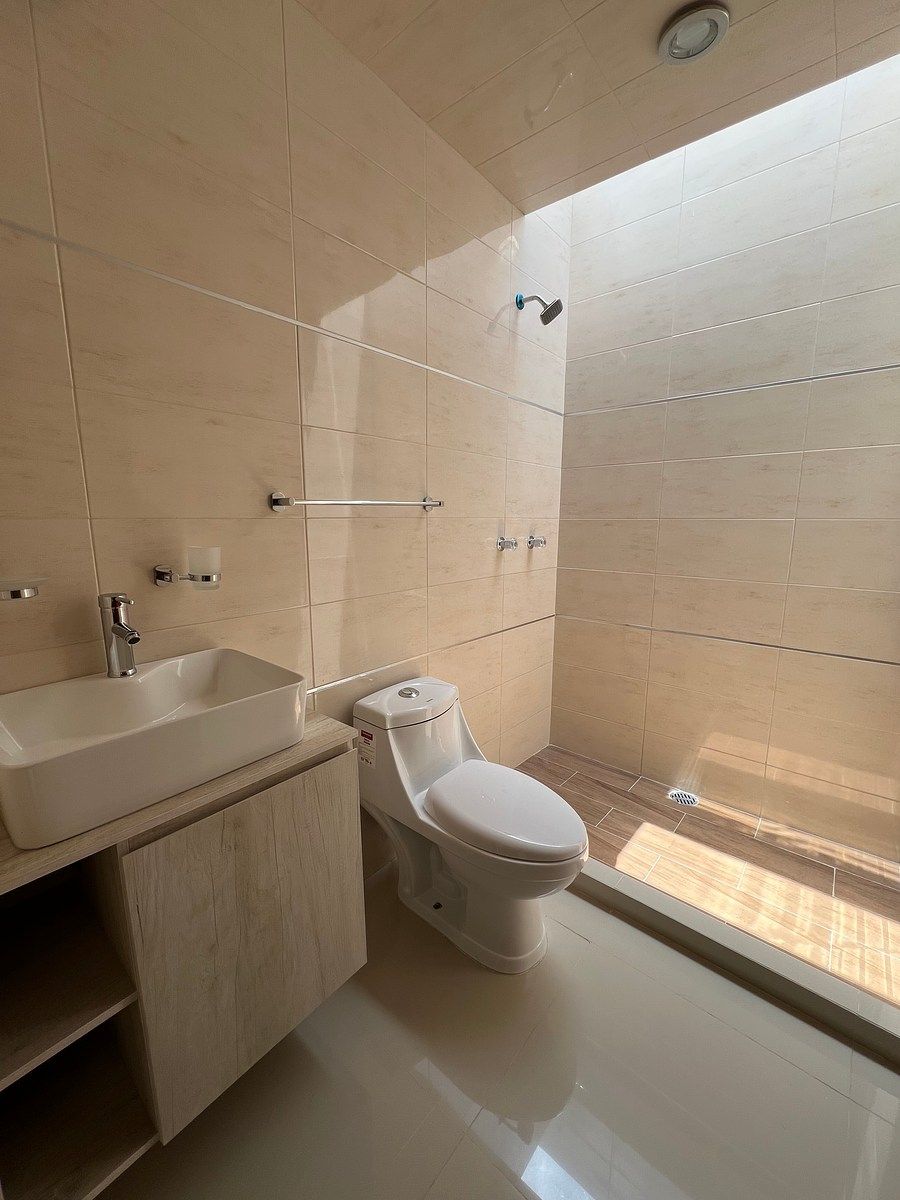 12 de 13: Baño compartido