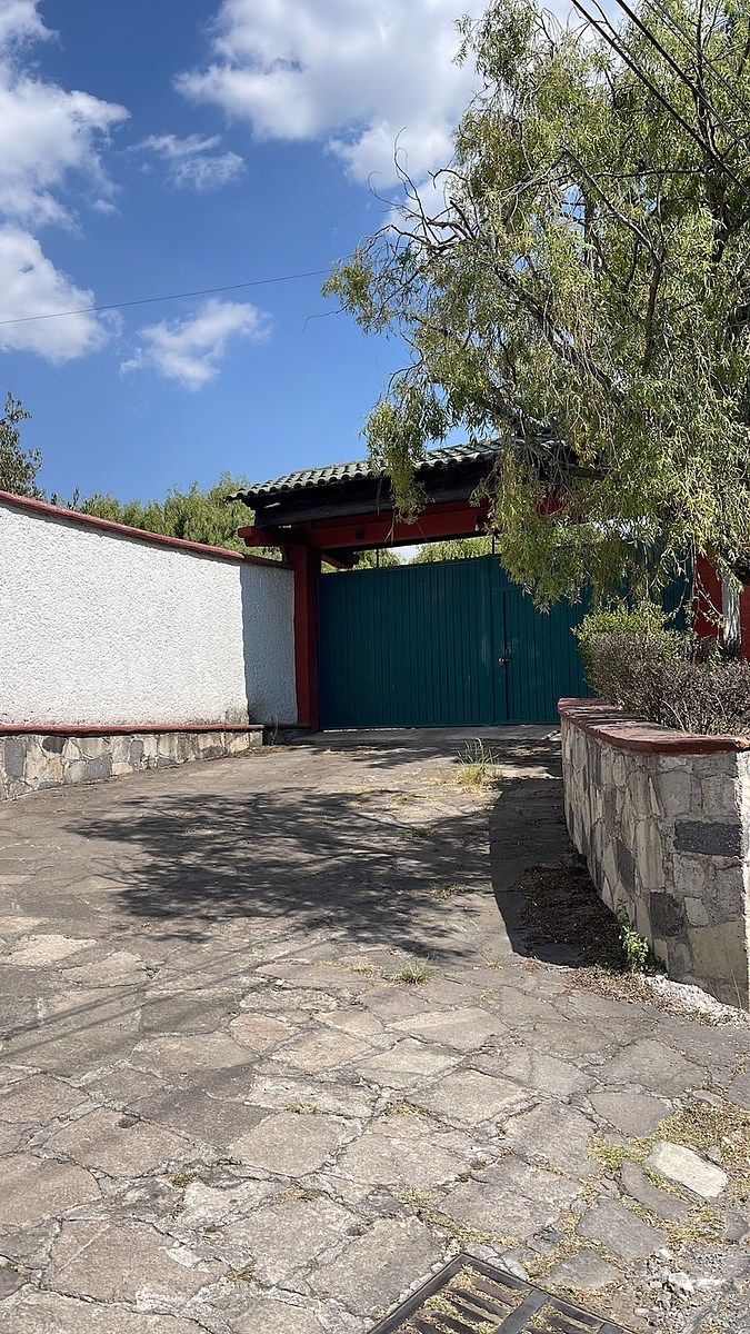 Terreno con Casa de un piso Cacalomacan, photo 1 of 11