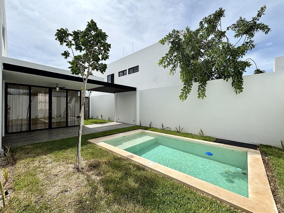 MONICA HOUSE WITH DOUBLE HEIGHT LIVING ROOM AND SOLAR PANELS IN DZITYÁ, photo 1 of 27