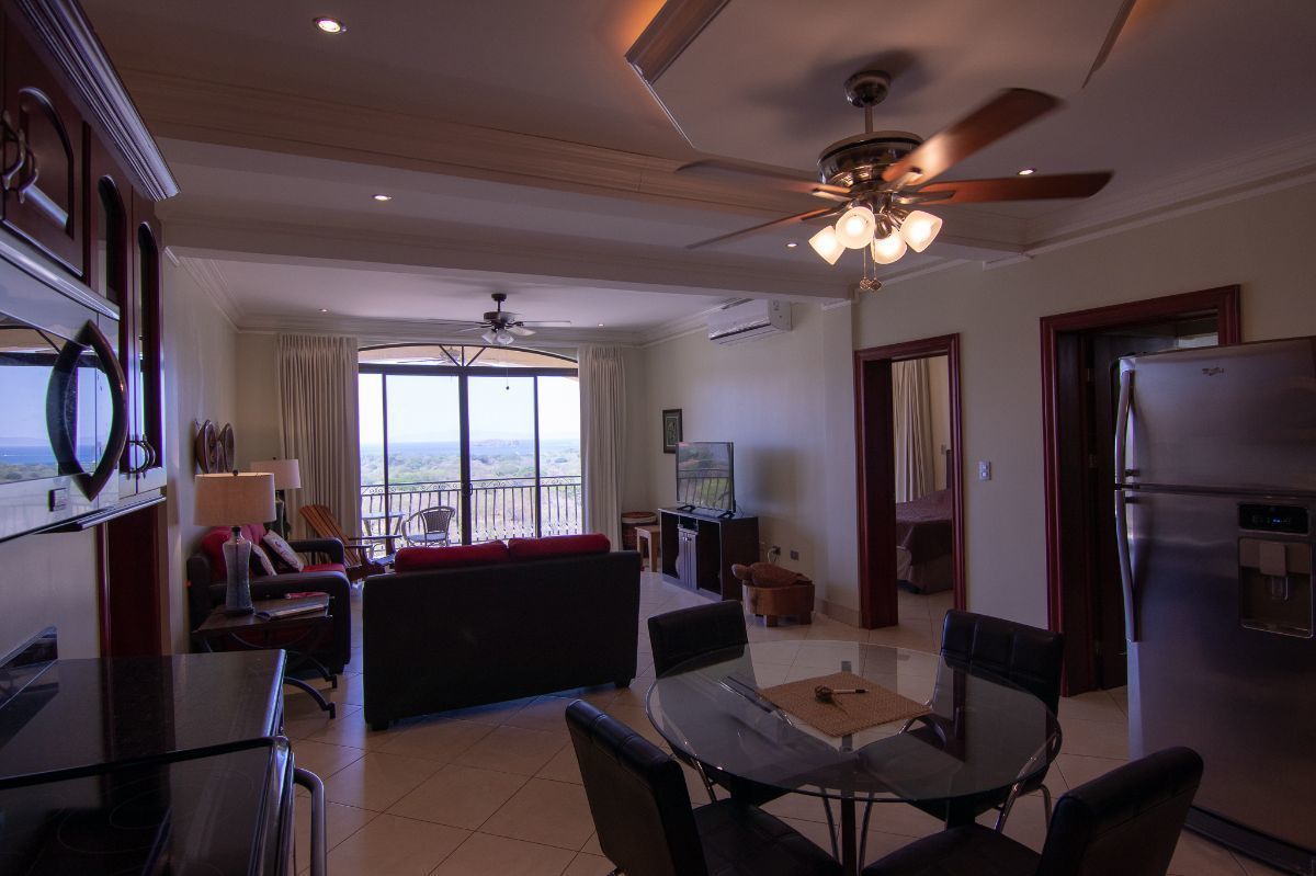 4 of 16: Ocean view living room and spacious kitchen