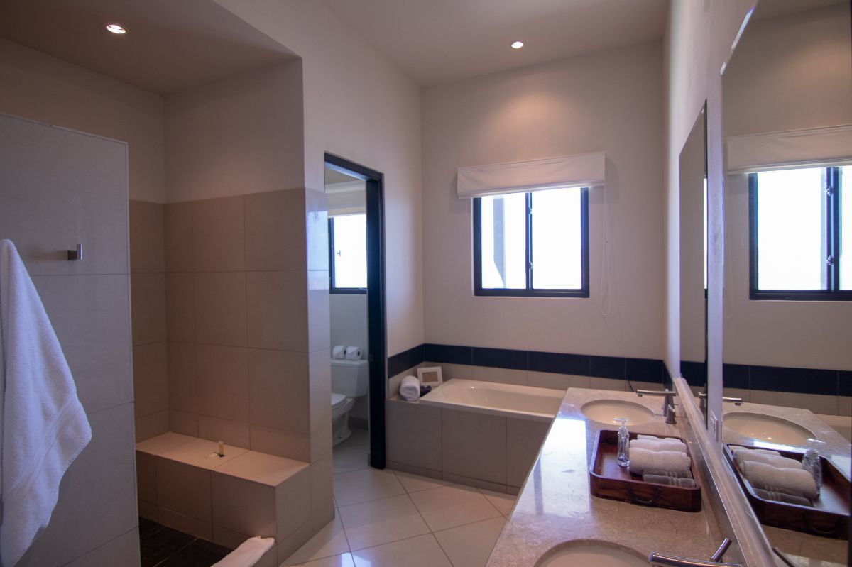 20 of 35: Master bathroom with bathtub and walk in shower